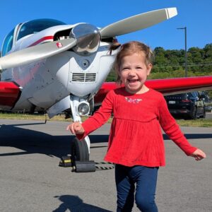 Reece in front of Tim's plane August 2025